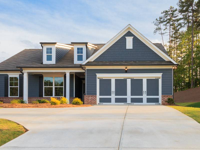 How Does A Cement Driveway Replacement Enhance My Home?